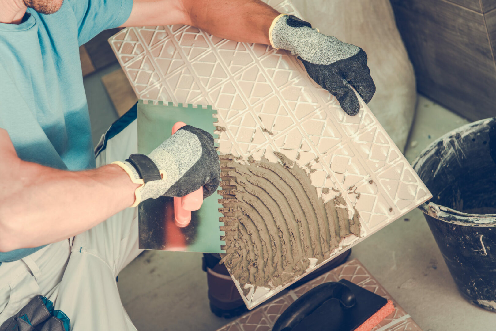 Tile adhesive application closeup